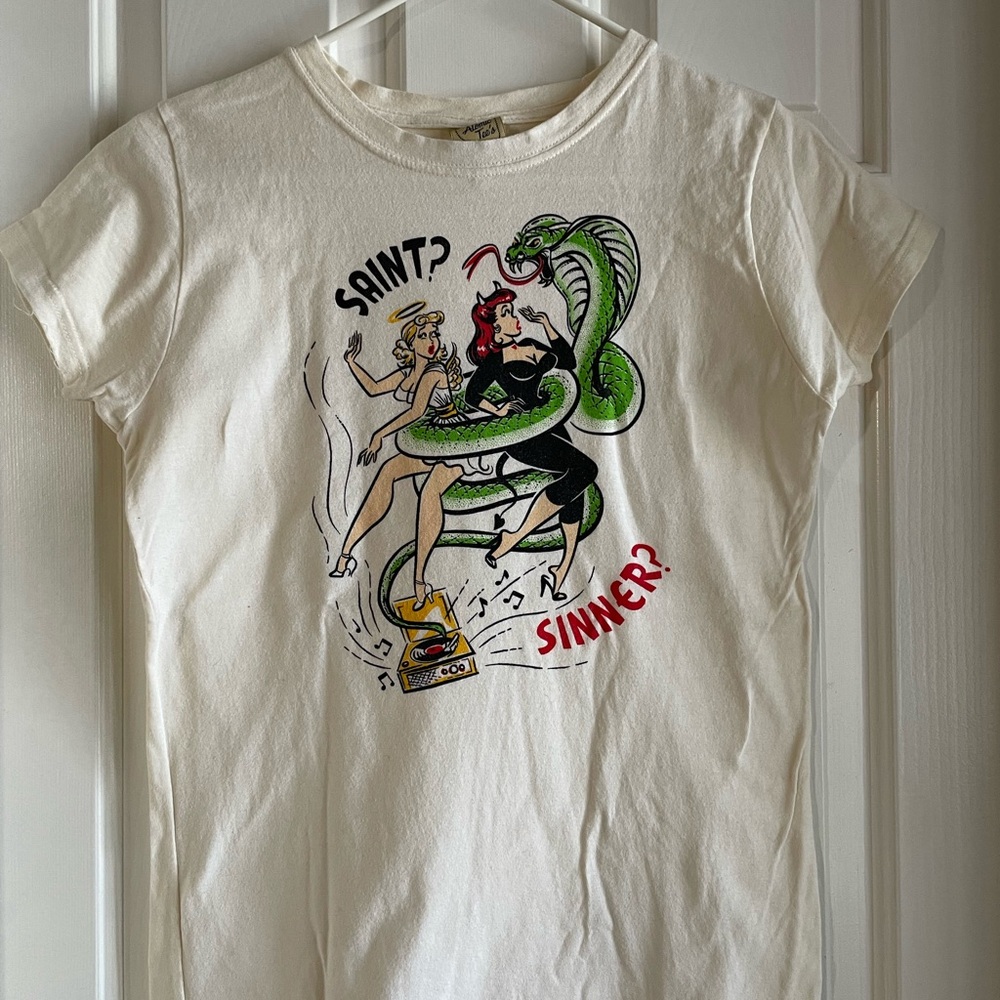 Atomic Tee’s Graphic Tee with Saint and Sinner Design